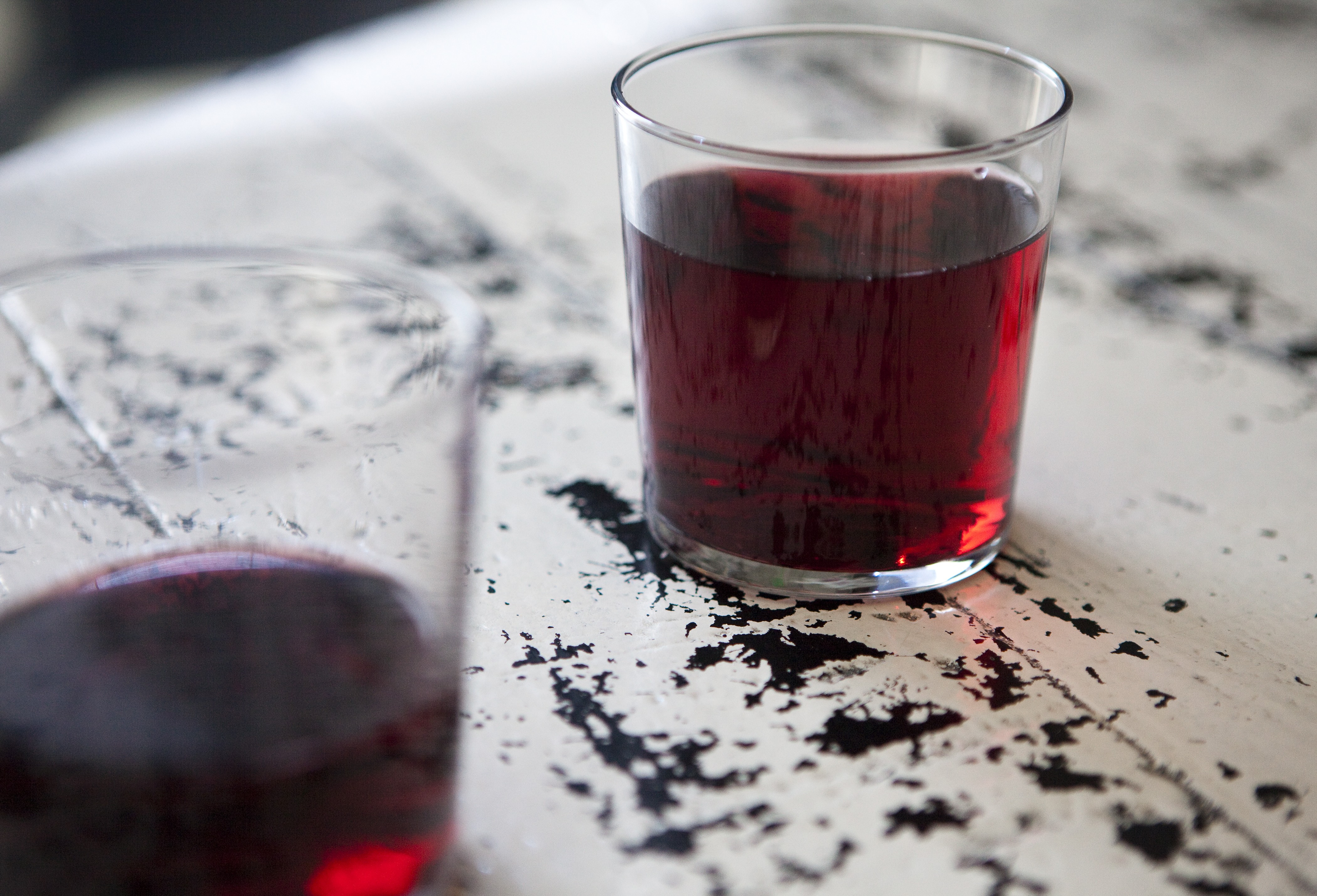 Glass of red wine on a marble table